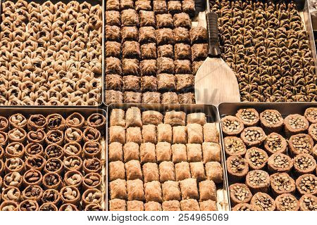 Turkish Baklava, Filled With Nuts, Walnuts, Pistaccios And Almonds For Sale On A Market In The City 