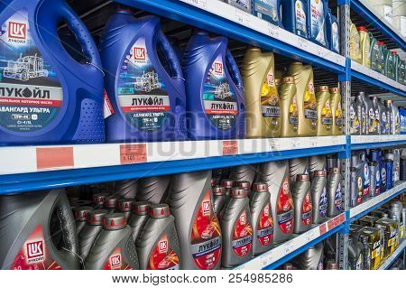 Omsk, Russia - August 22, 2018: Shop Window With Goods, Cans Of Motor Oil Of Different Manufacturers