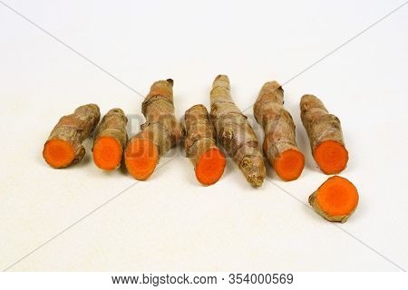 Fresh Turmeric Root Isolated On A White Background, Used As An Ingredient In Skin And Food Products.