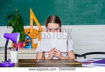 Back To School. Knowledge Day. Hometask Concept. Hooked On Learning. Girl Cute Child Sit School Clas