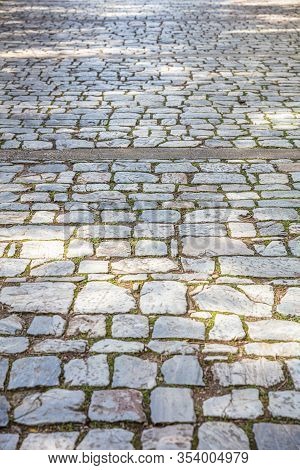 Stone Paved Footpath, Cobblestone Pathway Background Texture.