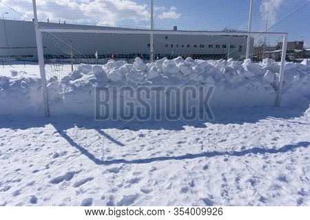 Old Abandoned Wooden Soccer Goal Covered With Snow During Winter Season