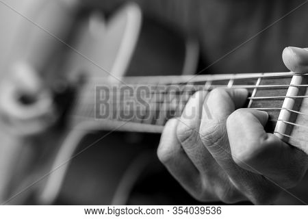 Musicians Are Playing Acoustic Guitar.