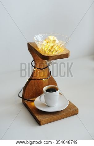 Creative Art Handmade Lamp Made Of Drip Coffee Station, V60 Dripper And Lights. Cup Of Black Coffee 