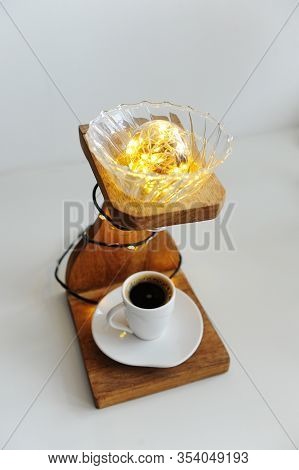 Creative Art Handmade Lamp Made Of Drip Coffee Station, V60 Dripper And Lights. Cup Of Black Coffee 