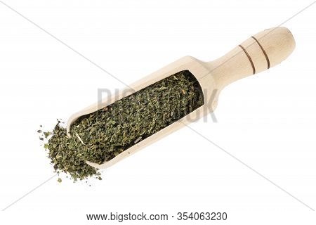 Dried Nettle Herb Or In Latin Utricae Folium In Wooden Scoop Isolated On White Background. Medicinal