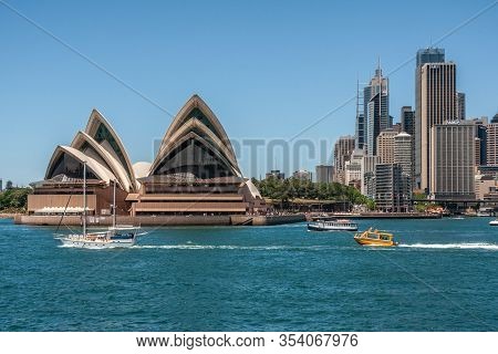 Sydney, Australia - December 11, 2009: Opera House. Frontal Closeup With Business Skyscrapers In Bac