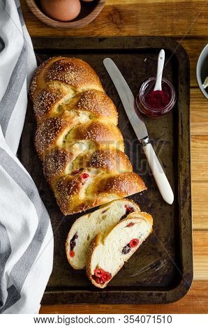 Traditional Sweet Easter Bread With Raisins, Dried Cherries On An Old Baking Tray Jam And Butter. Co