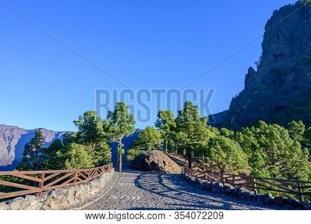 Scenic View On Caldera De Taburiente With Green Pine Forest, Ravines And Rocky Mountains Near Viewpo