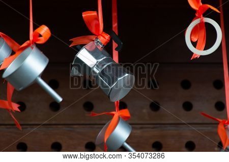 Christmas Decoration In Cafe, Traditional Italian Coffeemaker Macchinettas Hanging On Red Ribbons Ou
