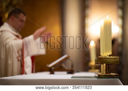 Priests during a mass/wedding ceremony/nuptial mass (shallow DOF; color toned image)