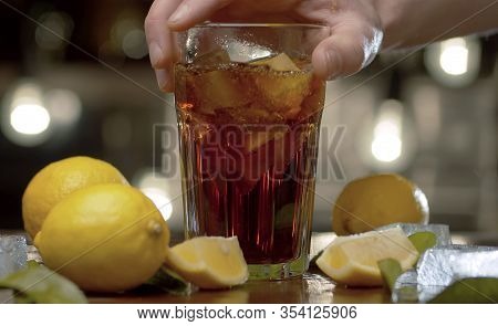 Male Hand Putting A Glass On The Table