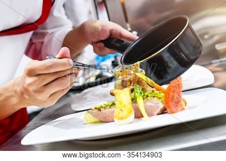Chef Cooking, Chef Preparing Food In The Kitchen, Chef Decorating Dish, Closeup