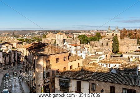 Toledo, Spain - December 6, 2019: Cityscape Of Toledo From The Ramparts With Puerta De La Bisagra, A