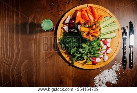 Fresh Chopped Vegetables On A Wooden Board.top View