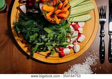 Fresh Chopped Vegetables On A Wooden Board.top View