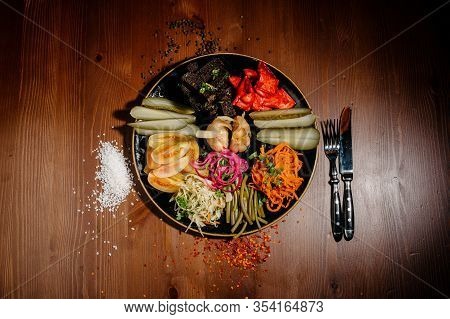 Different Types Of Vegetables On Black Plate.top View