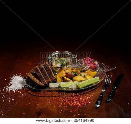 Top View Of Plate With Fried Potatoes With Pickled Mushrooms