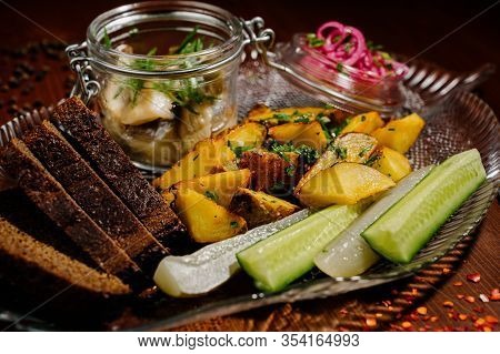 Top View Of Plate With Fried Potatoes With Pickled Mushrooms