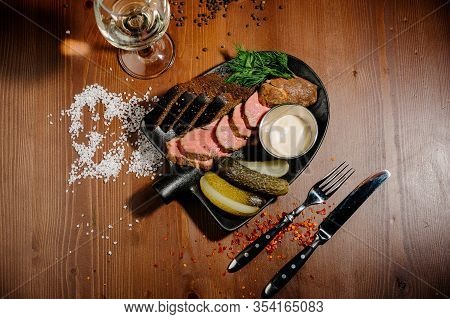 Ham With Bread And Pickles On A Plate.top View
