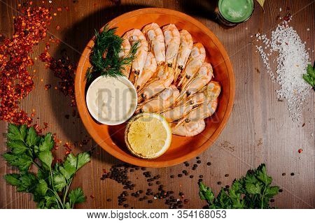 Grilled Shrimps Or Prawns Served With Lemon And Sauce.top View