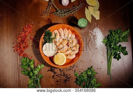 Grilled Shrimps Or Prawns Served With Lemon And Sauce.top View