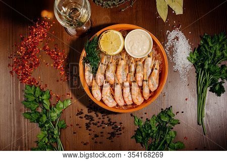 Grilled Shrimps Or Prawns Served With Lemon And Sauce.top View