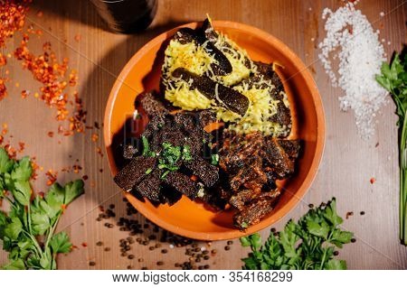 Rusks With Cheese, Leek, Sauce On A Wooden Old Table.top View