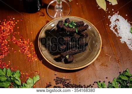 Rusks With Leek, Sauce On A Wooden Old Table
