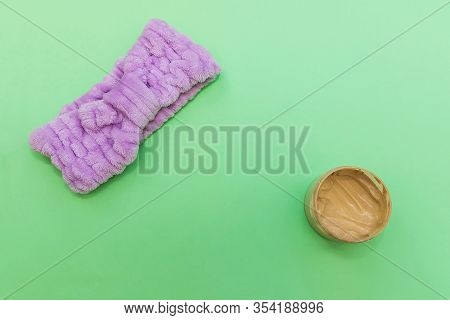 Purple Headband And Jar Of Cosmetic Scrub