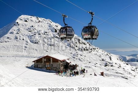 Jasna, Slovakia - March 13: Modern Cableway In Ski Resort Jasna - Low Tatras Mountains And Cottage W