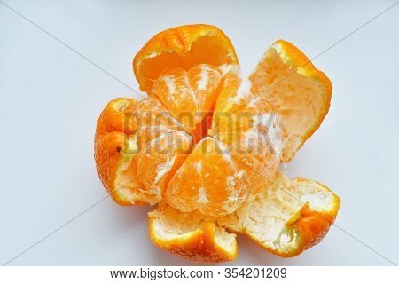 Peeled Tangerine On A White Background.orange Fruits And Peeled Segment Isolated. Pile Of Orange Seg