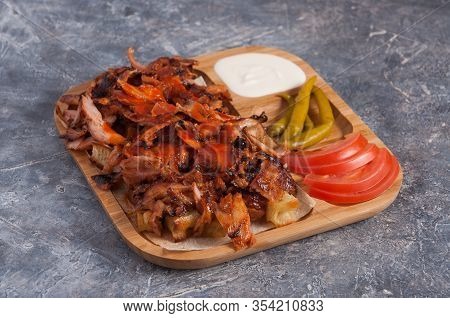 Turkish Doner With Chicken On A Wooden Plate