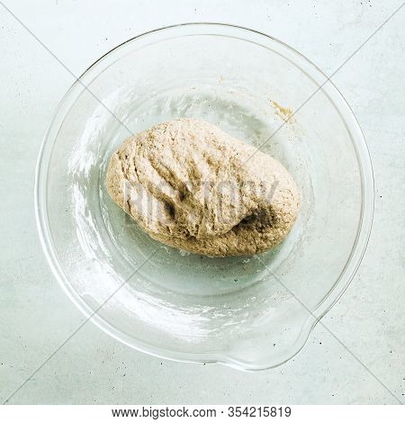 Cooking Dough For Pita Bread On A Table In A Glass Bowl, Rolling Pin And Knife