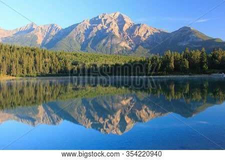 Beautiful Reflection Af A Canadian Mountain In The Lake , Jasper National Park, Canada