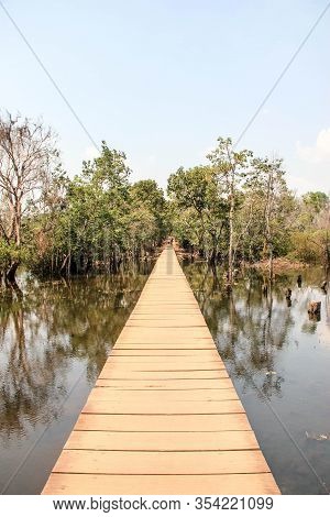 Wooden Bridge Over A Small River In Ankor Wat. Connection Between Two Temples, Cambodia