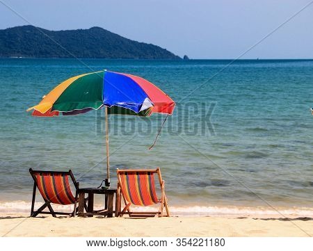 Beach Chairs With Colorful Umbrella At Ocean Front, Koh Samui, Thailand