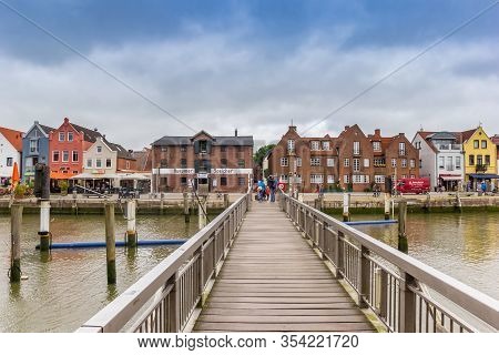 Husum, Germany - June 27, 2019: Wooden Jetty At The Old Harbor In Husum, Germany