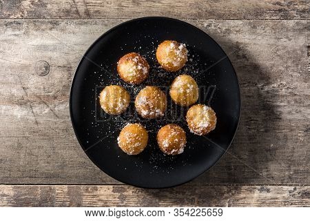Carnival Fritters Or Buñuelos De Viento For Holy Week On Wooden Table. Top View