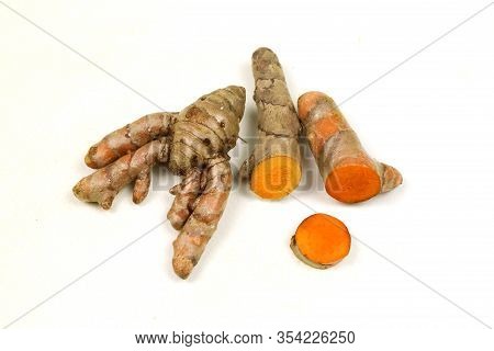 Fresh Turmeric Root Isolated On A White Background Is An Ingredient In Turmeric Foods And Ingredient