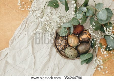 Happy Easter Flat Lay. Modern Easter Eggs With Spring Flowers And Eucalyptus On Rustic Wooden Table.