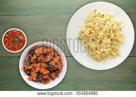 Vermicelli On A White Plate On Green Wooden Background. Vermicelli On A Plate With Vegetarion Salad 