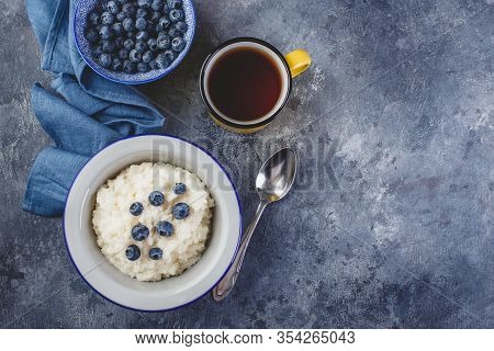 Milk Rice Porridge With Blueberry, Creamy Rice Pudding Or French Riz Au Lait In A Metal Bowl And Ena