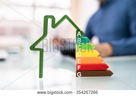 Cropped Image Of Businessman Calculating Energy Efficiency Rate In Office