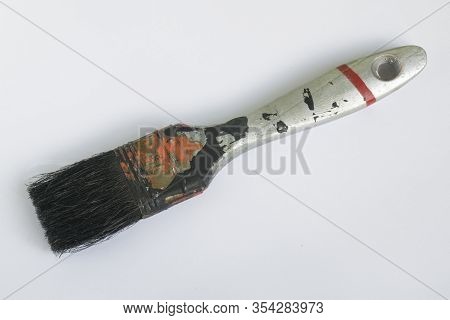 The Used  Flat Brushe For Painting  Lies On A White Background