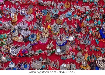 Colorful Indian Style Traditional Earrings On Red Background