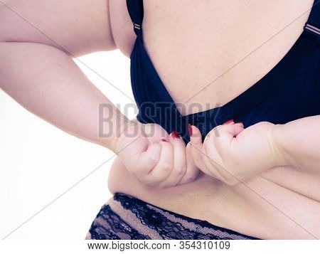 Fat Woman Rear View Opening Taking Off Or Putting On Her Bra. Plus Size Overweight Female Model Wear
