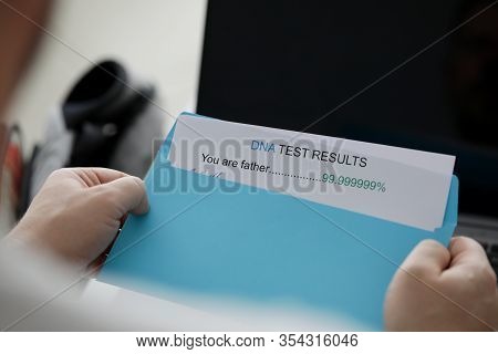 Man Received Letter In Envelope With Dna Test For Paternity. Unwanted Child Concept. Medical Genetic