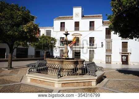 Estepa, Spain - November 13, 2008 - Fountain In The Plaza Del Carmen With The Town Hall (ayuntamient