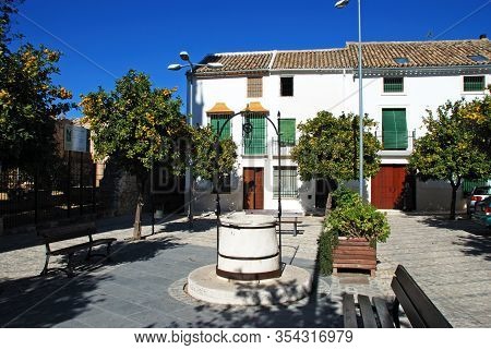 Estepa, Spain - November 13, 2008 - Water Well And Orange Trees In The Plaza De La Victoria, Estepa,